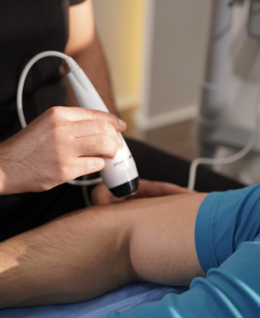 Physiotherapist treating a patient with tennis elbow through targeted exercises
