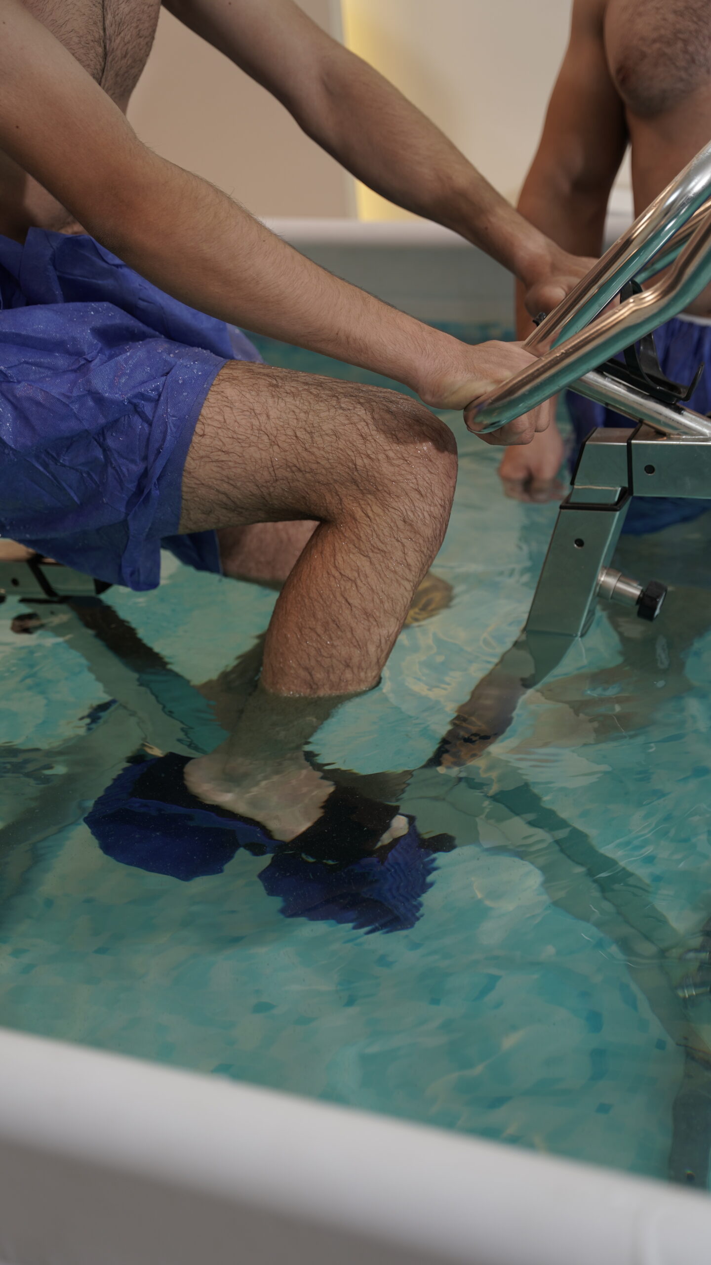 Close-up of feet in warm water during hydrotherapy treatment
