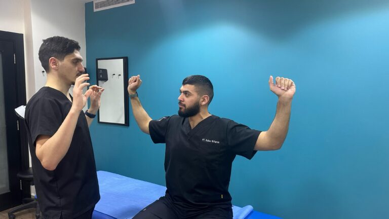 Physiotherapist performing shoulder and neck exercises for thoracic outlet syndrome