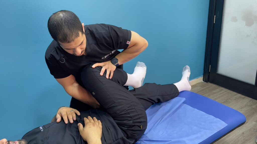 Physiotherapist treating a patient with piriformis syndrome through targeted stretching