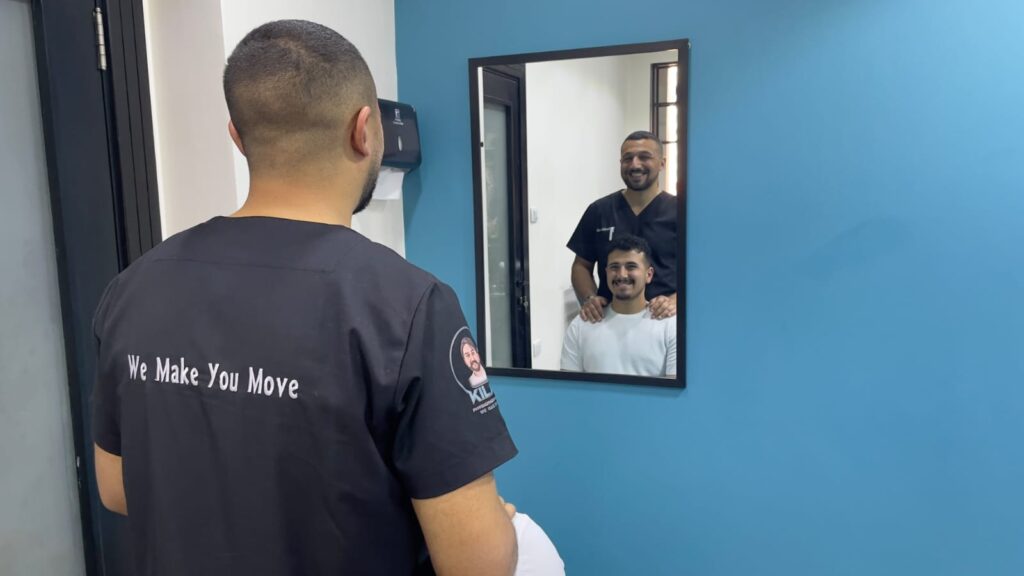 Physiotherapist treating a patient with facial palsy using facial exercises